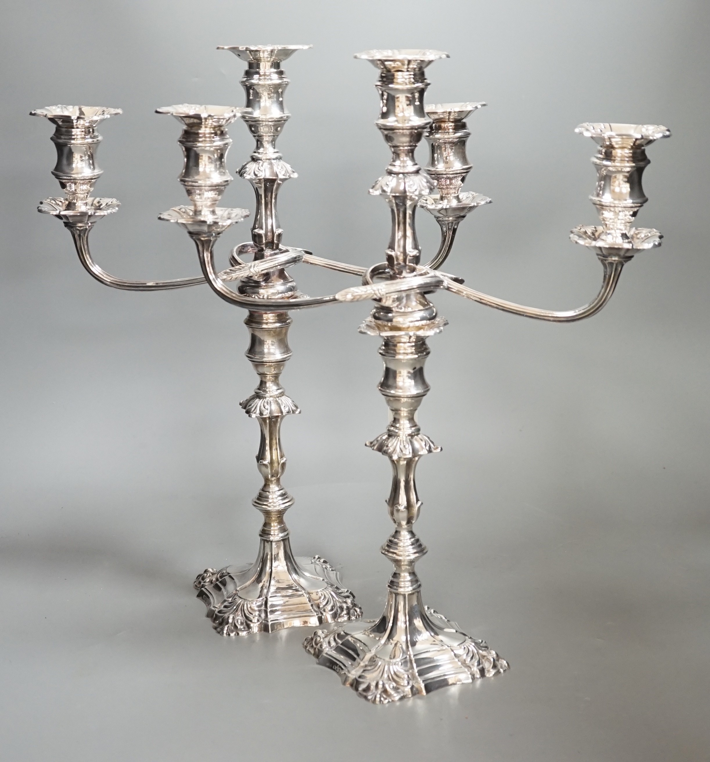 A pair of 1950's silver two branch, three light candelabra, by Atkin Brothers, Sheffield, 1954, height, 40cm, weighted, arms weigh 56oz.